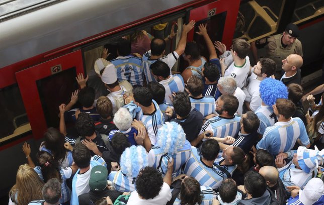 Argentina fans board a train at Luz Station to catch the 2014 World Cup semi-fin