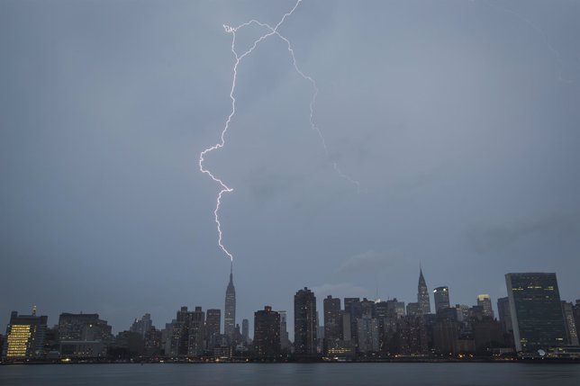 Bolt of lightning strikes the Empire State Building during a summer rain storm i
