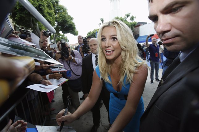 Singer Britney Spears signs autographs at the premiere of 