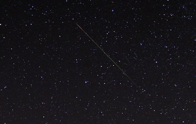 A meteor streaks over the North Star in the northern skies during the Perseid me