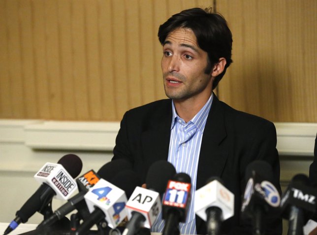 Plaintiff Michael Egan speaks at a news conference at the Four Seasons Hotel in 