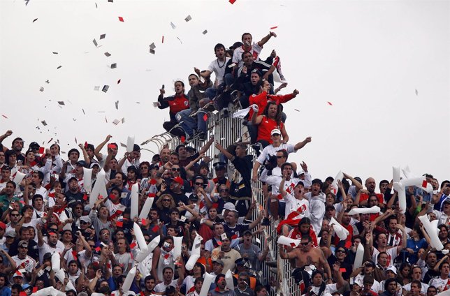 River Plate's soccer fans cheer for their team against Boca Juniors in a soccer 