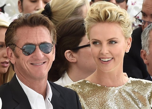 Sean Penn and Charlize Theron attend the Christi