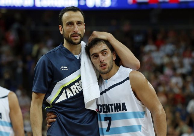 Argentina's Ginobili and teammate Campazzo walk off the court after losing to th