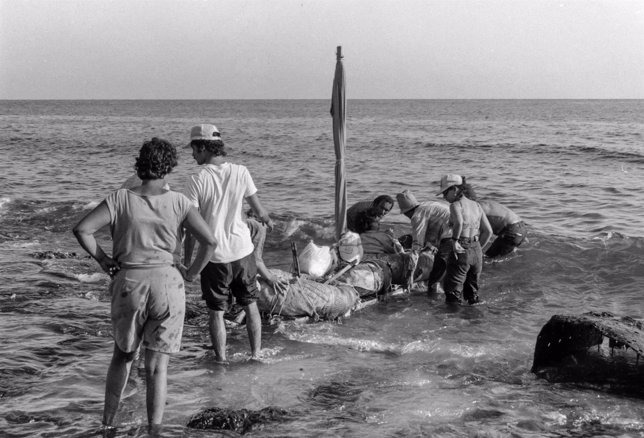 Would-be emigrants launch a makeshift boat into the Straits of Florida towards t
