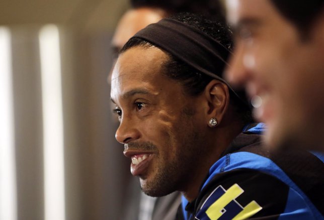 Soccer player Ronaldinho attends a news conference after signing with Queretaro 