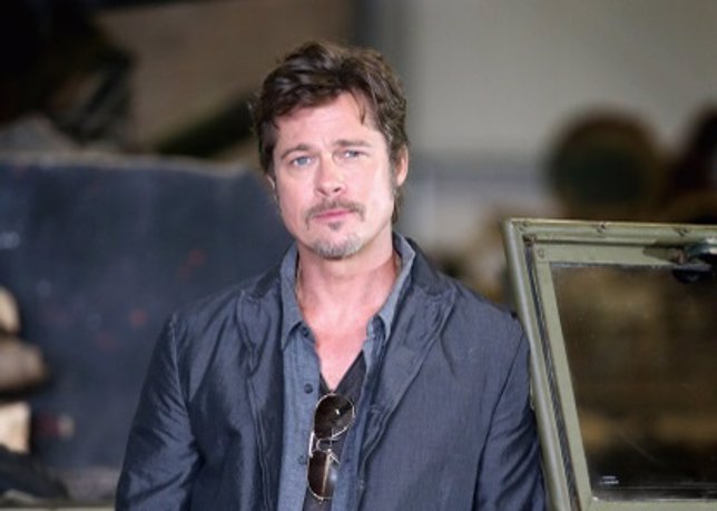 BOVINGTON, DORSET - AUGUST 28:  Actor Brad Pitt poses in front of a Sherman Tank