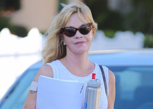 Beverly Hills, CA - Melanie Griffith smiles for the cameras after a skin care sa