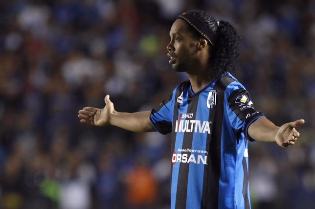 Queretaro's Ronaldinho gestures during a Copa MX soccer match against Tigres in 