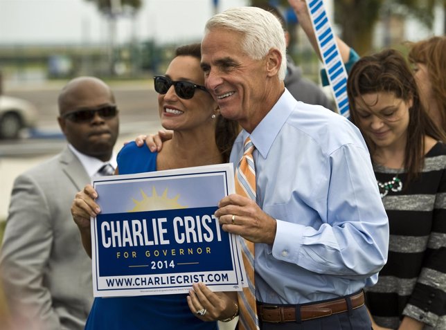 Former Republican Governor Crist and his wife, Carole, greet supporters in a wat
