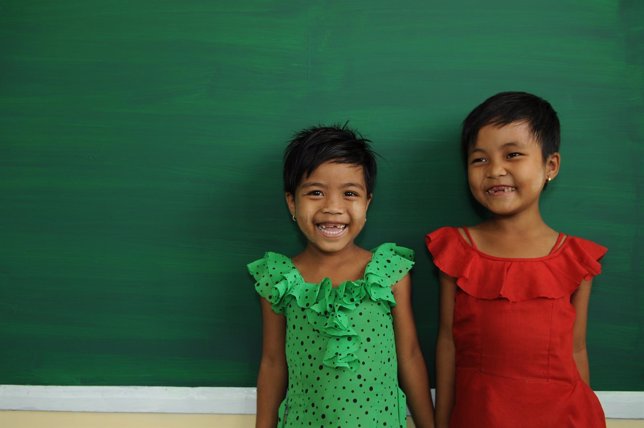 6-Year-Old Lae Lae Aung (In Green) And 6-Year-Old May Tha Zin Standing In Front 