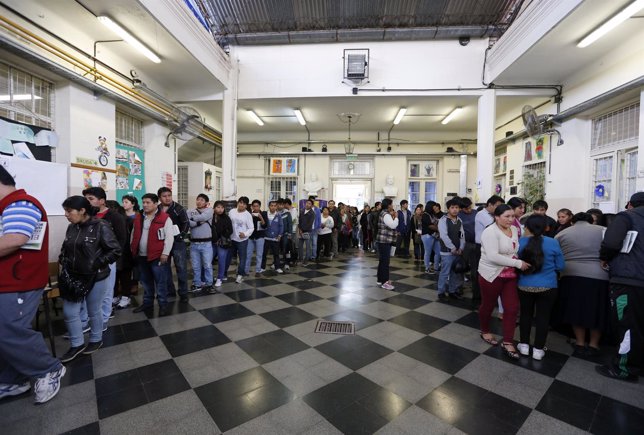 Bolivian residents living in Argentina line up to vote at a public school in Bol
