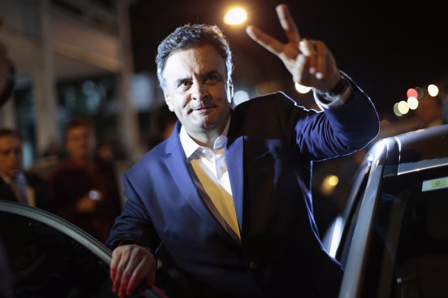 Brazil's PSDB presidential candidate Aecio Neves reacts after a meeting where he
