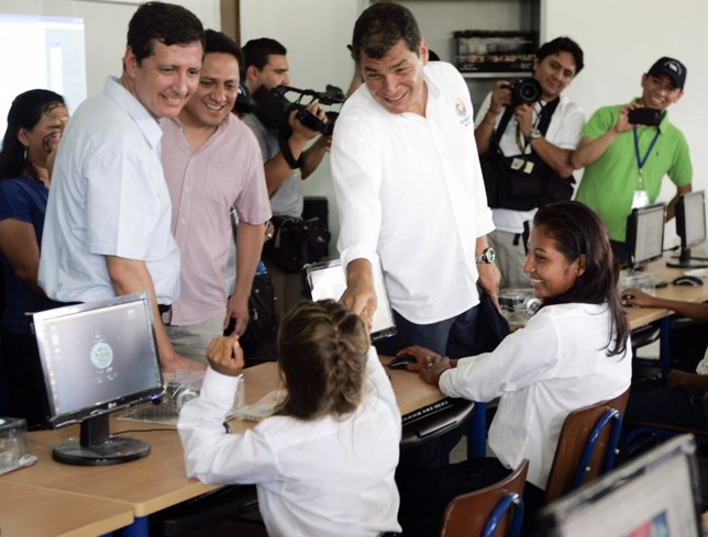 Ecuador's President Rafael Correa smiles as he meets students of Panacocha schoo