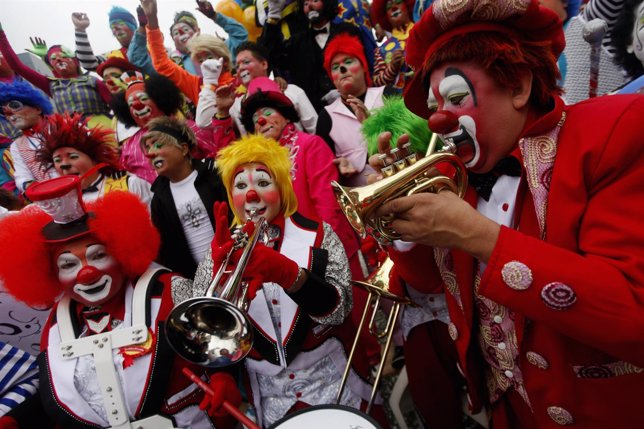 Clowns play music as they rally for peace during 18th Latin American clown conve