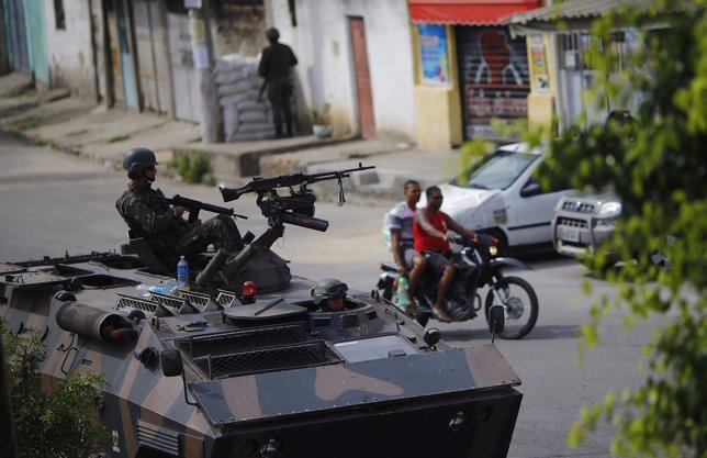 Brazil's Navy soldiers patrol the Mare slums complex ahead of Sunday's election 