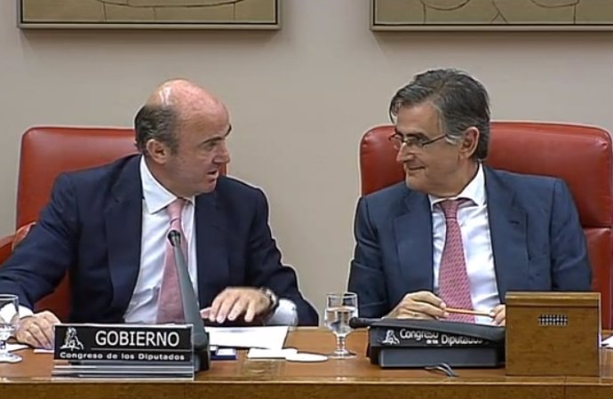 Guindos y Ovidio Sánchez en el Congreso