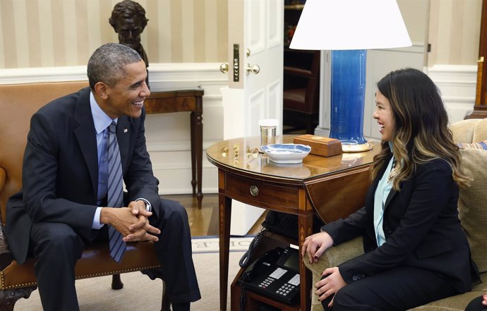 U.S. President Obama smiles with Dallas nurse Pham at the Oval Office in Washing