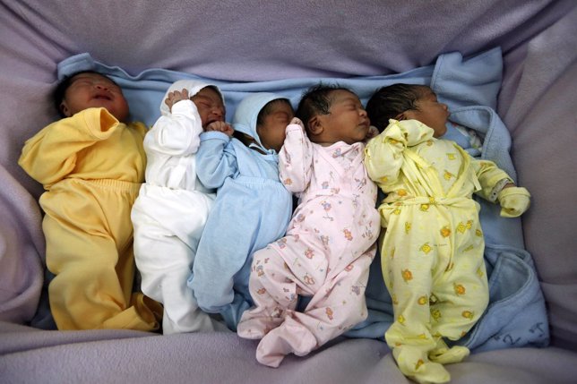 Newborn babies wait for attention at Lima's Maternity hospital