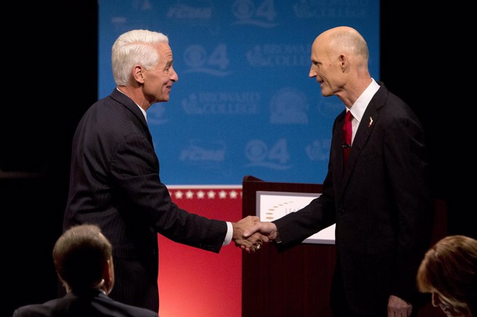 El gobernador de Florida, Rick Scott, y su rival Charlie Crist