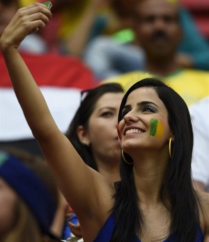 A fan takes a selfie before the 2014 World Cup round of 16 