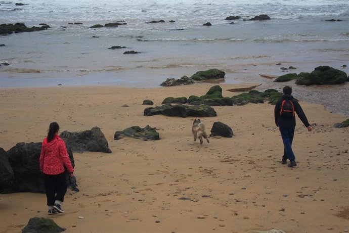Turistas En La Playa