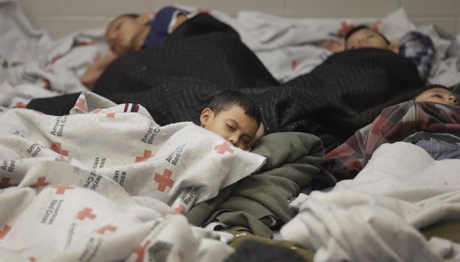 Detainees sleep in a holding cell at a U.S. Customs and Border Protection proces