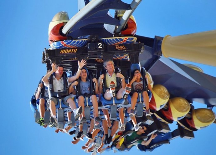 People ride the Montu roller coaster at Busch Garden