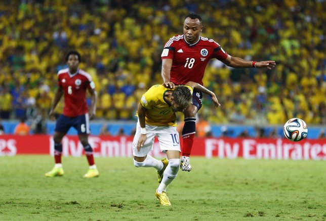 Brazil's Neymar is fouled by Colombia's Camilo Zuniga during 2014 World Cup quar