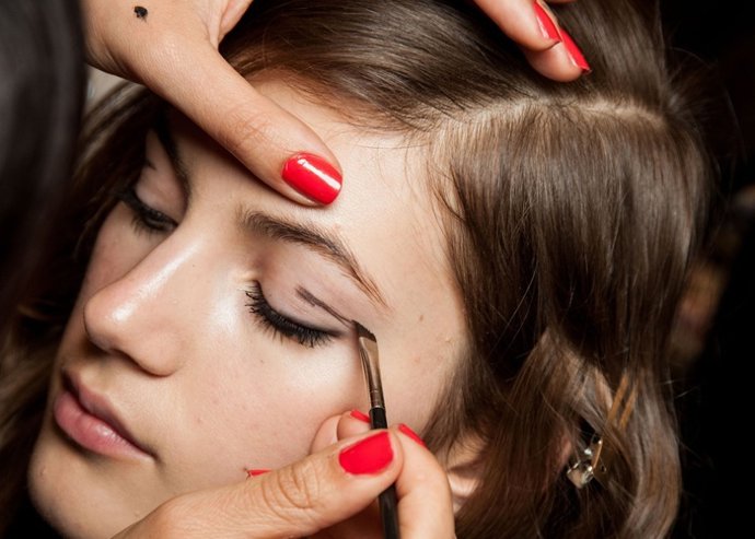 Model backstage in a beauty, makeup and hair shoot, as part of the women's ready