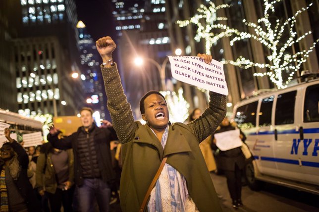 People take part in a protest against the grand jury decision on the death of Er