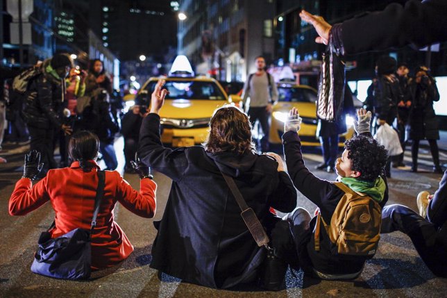 Demonstrators block a street in Lower Manhattan while they protest a grand jury 