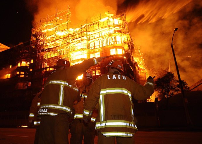 Los Angeles city firefighters battle a massive fire at a seven-story downtown ap