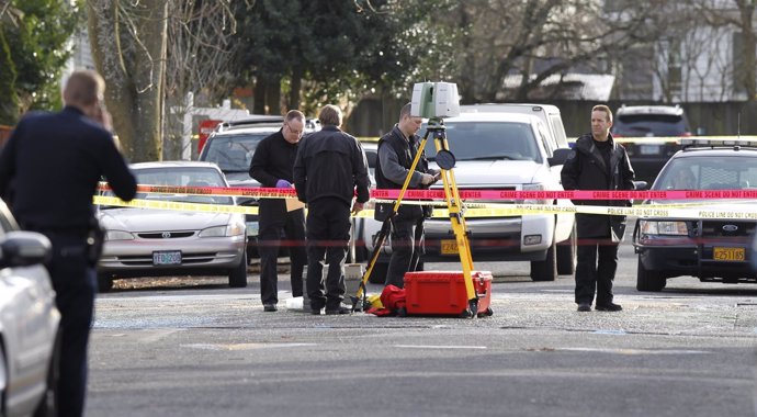 Police investigate outside the Rosemary Anderson High School in Portland, Oregon