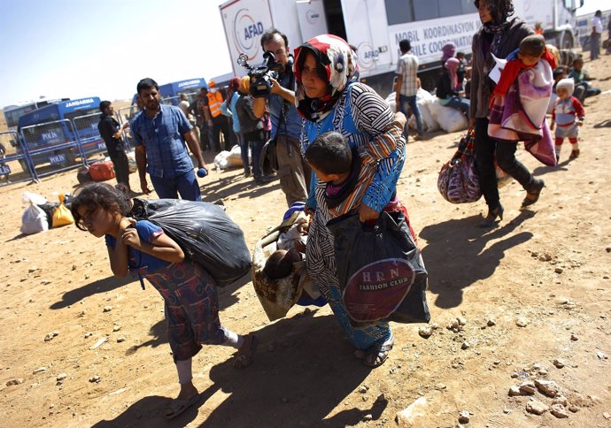 Refugiados sirios kurdos llegando a Turquía