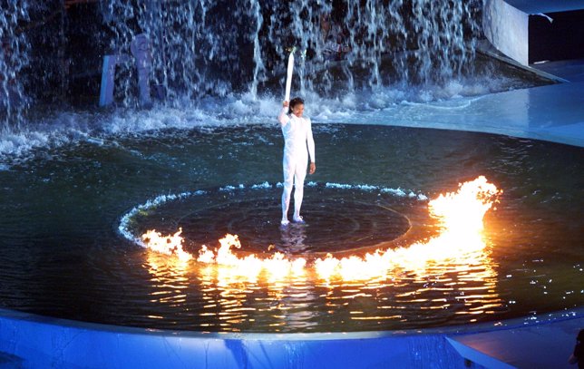 Australian Aboriginal 400m runner Cathy Freeman stands with the Olympic torch af