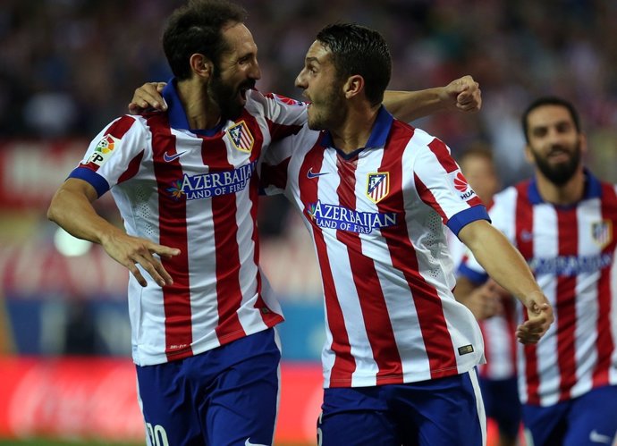 Koke y Juanfran celebran un gol del Atlético de Madrid