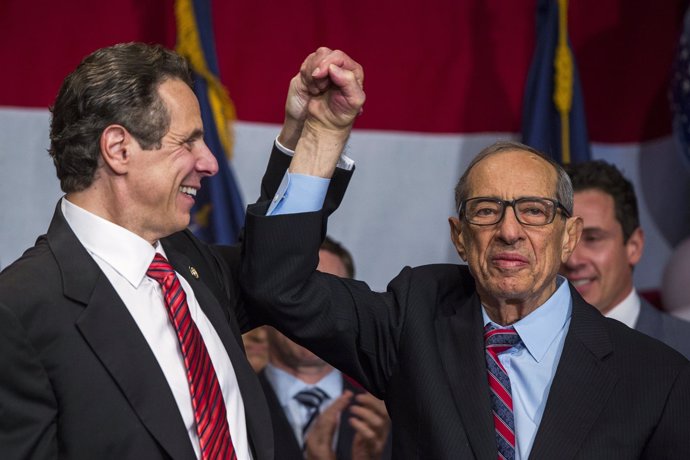 Democratic Governor Andrew Cuomo reacts with his father Mario after being re-ele