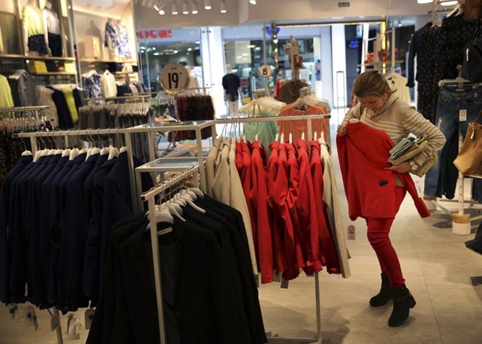 A woman shops at a Lefties store in Madrid March 14, 2014.  While Inditex's Zara