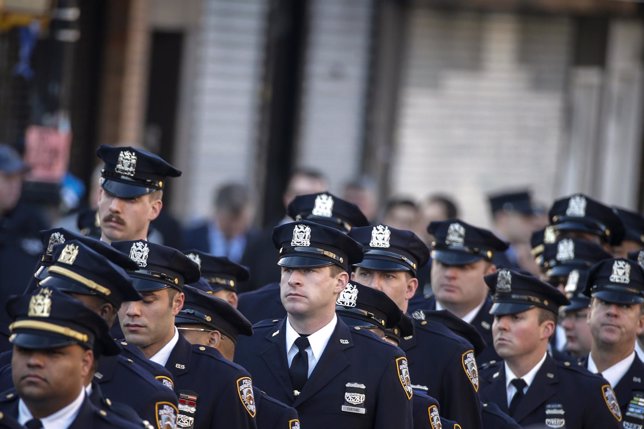 Policemen line-up near the Christ Tabernacle Church ahead of the funeral service
