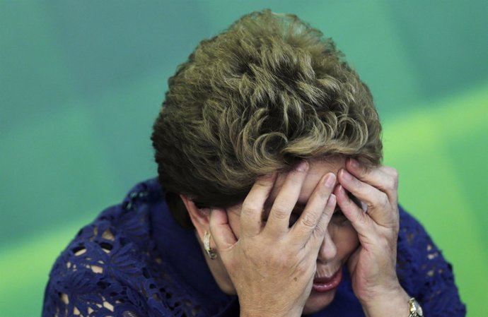 Brazilian President Dilma Rousseff reacts during a breakfast meeting with the me