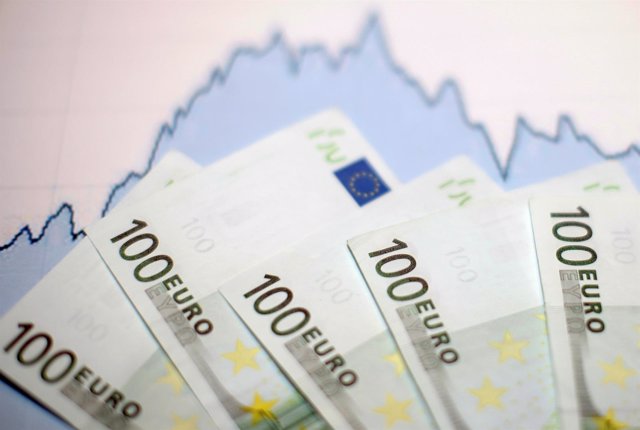Euro banknotes are placed on a currency graph in this picture illustration taken