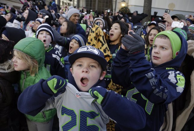 Young Seahawks fans cheer during the NFL team's Super Bowl victory parade in Sea