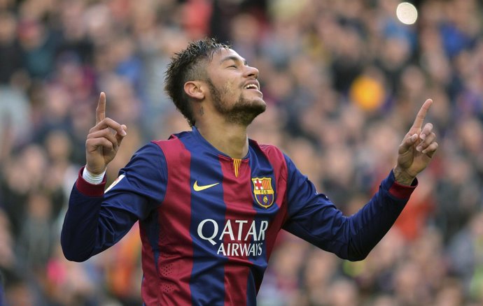 Barcelona's Neymar celebrates his goal against Levante during their Spanish firs