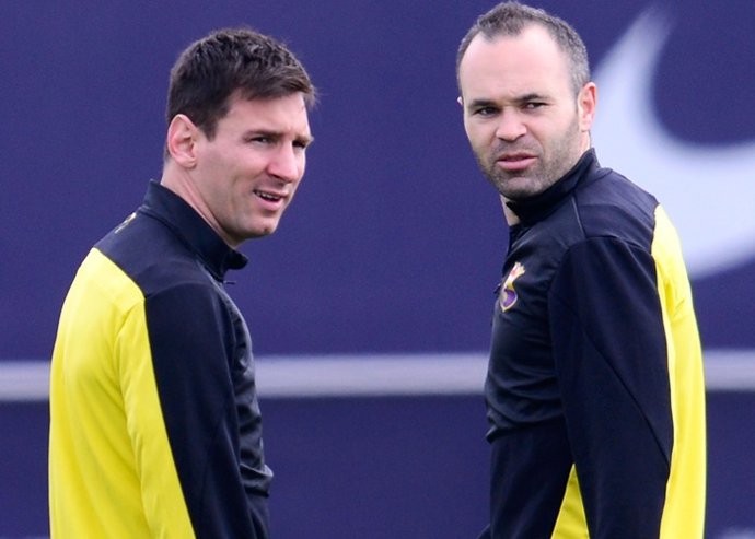 Lionel Messi And His Teammate Andres Iniesta Of FC