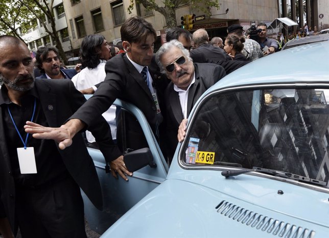 Jose Mujica gets into his Volkswagen Beetle after handing over the presidential 