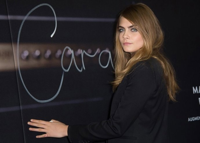 Cara Delevingne attends the Yves Saint Laurent Be