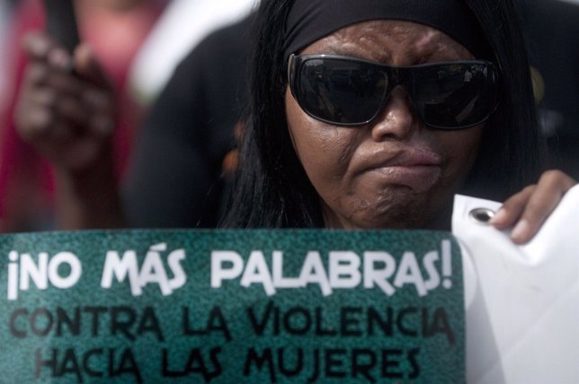 Petronila Santana, whose husband attacked her with acid, participates in a march