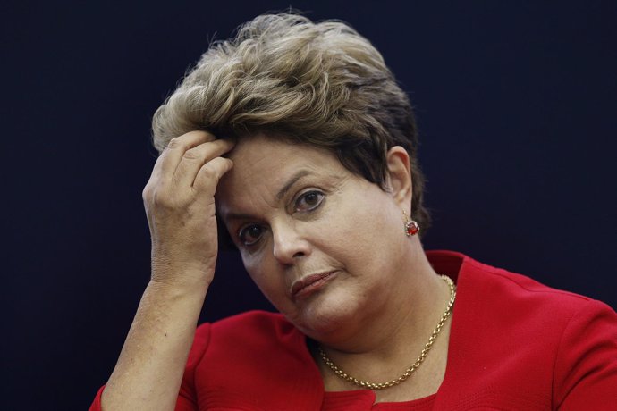 Brazil's President Dilma Rousseff reacts during a news conference on the 2014 Wo