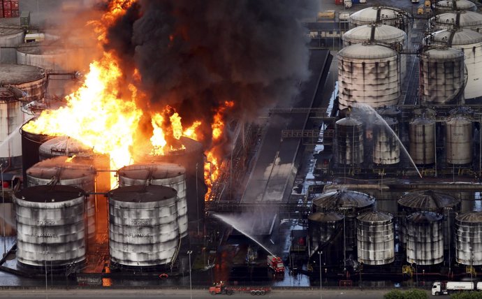 Smoke rises from a fire at a fuel tank storage facility run by Ultracargo in San